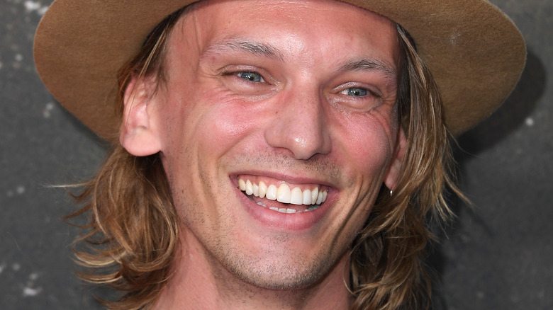 Jamie Campbell Bower smiling