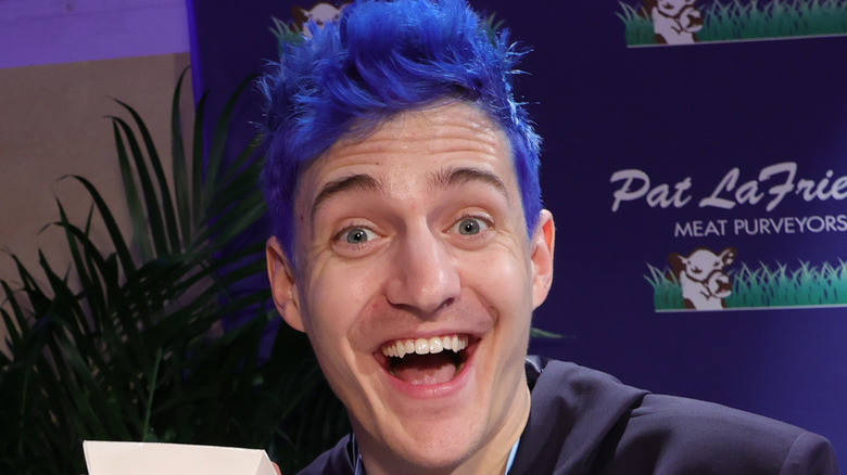 Ninja with dark blue hair grinning
