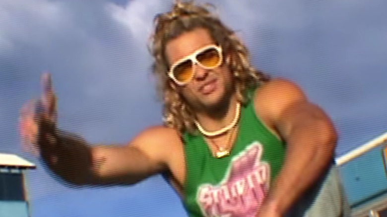 Ken wearing shades and a green tank top in Street Fighter