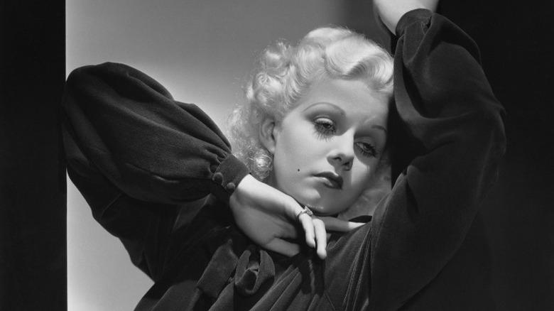 Jean Harlow posing in a black blouse