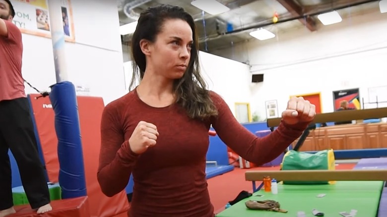 An actor being trained to do fight stunts