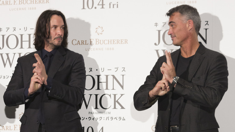 Chad Stahelski and Keanu Reeves making finger guns