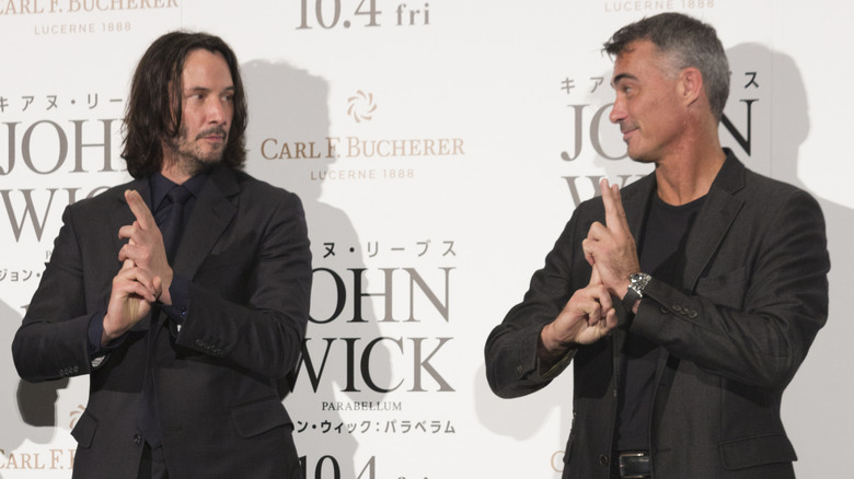 Chad Stahelski and Keanu Reeves making finger guns
