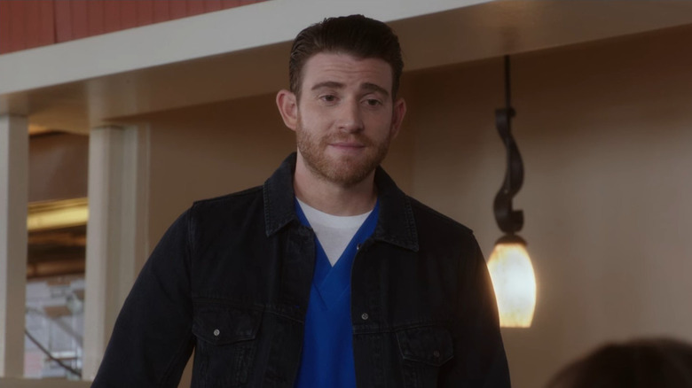 Ben standing in a diner in "The Mindy Project."