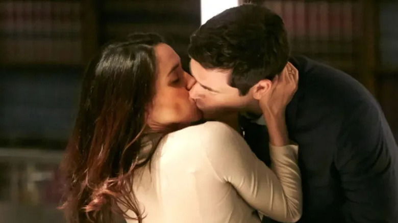 Rachel and Logan kissing