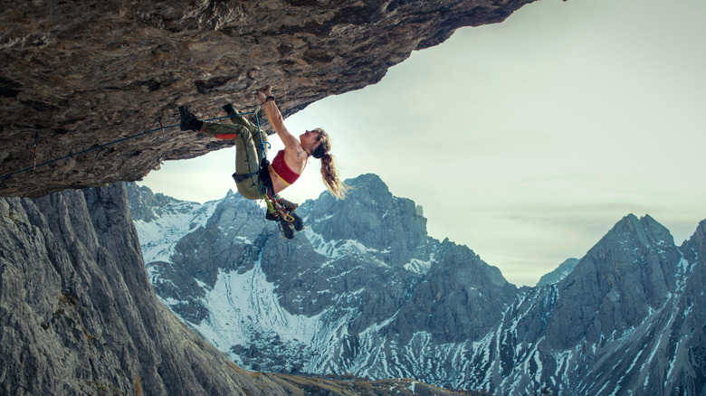 Naomi Cooper scaling a mountain in Cliffhanger (2026)