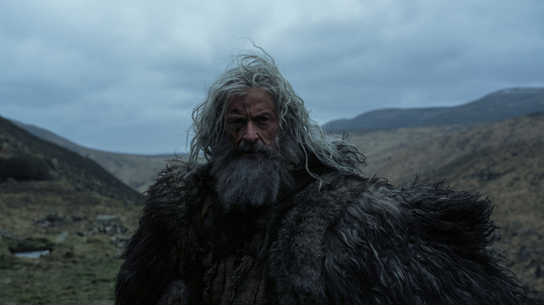 Robin Hood looking gruff against roaming hills in The Death of Robin Hood (2026)