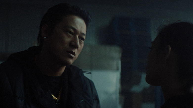 Sung Kang speaks to woman