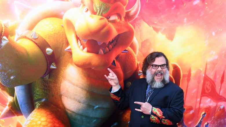 Jack Black posing beside Bowser