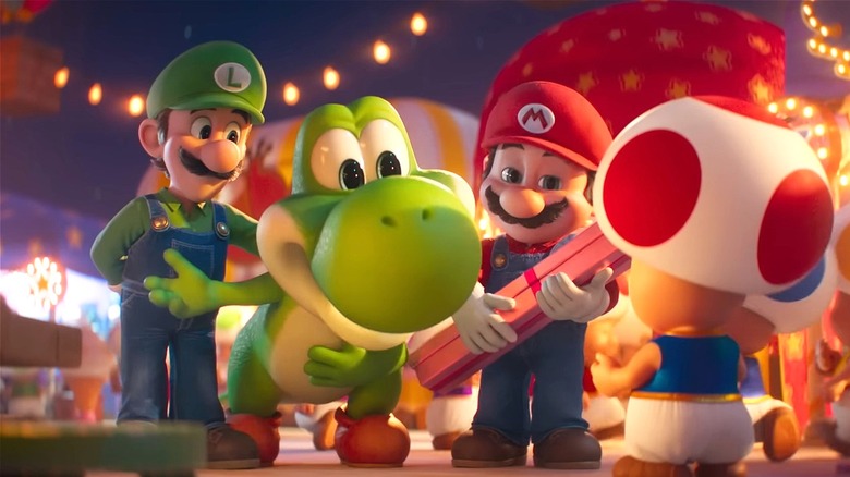 Yoshi speaking to Toad flanked by Mario and Luigi in The Super Mario Galaxy Movie