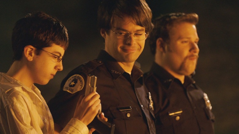 Officer Slater shows McLovin his gun in "Superbad" (2007)