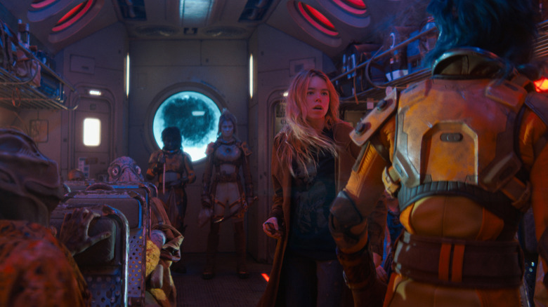 Supergirl fighting space pirates on a bus ship in Supergirl (2026)