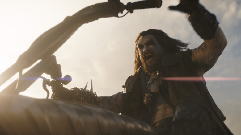 Lobo shouting with sadistic glee as he rides his spacehog in Supergirl (2026)