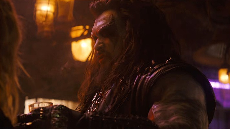 Lobo glaring at Kara in bar