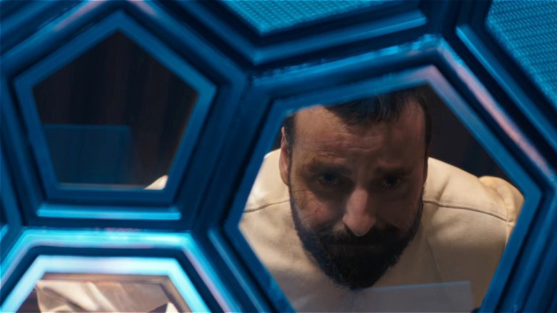 Zor-El looking sad through window in Supergirl movie