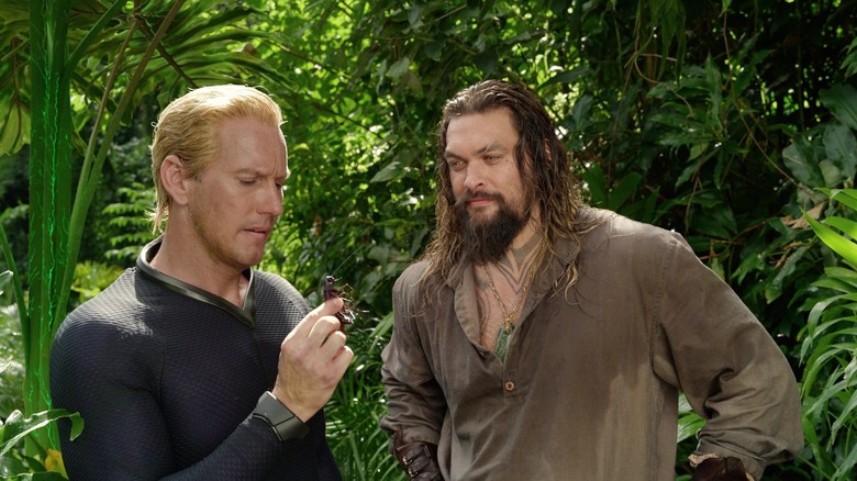 Orm and Aquaman looking at a bug in Aquaman and the Lost Kingdom