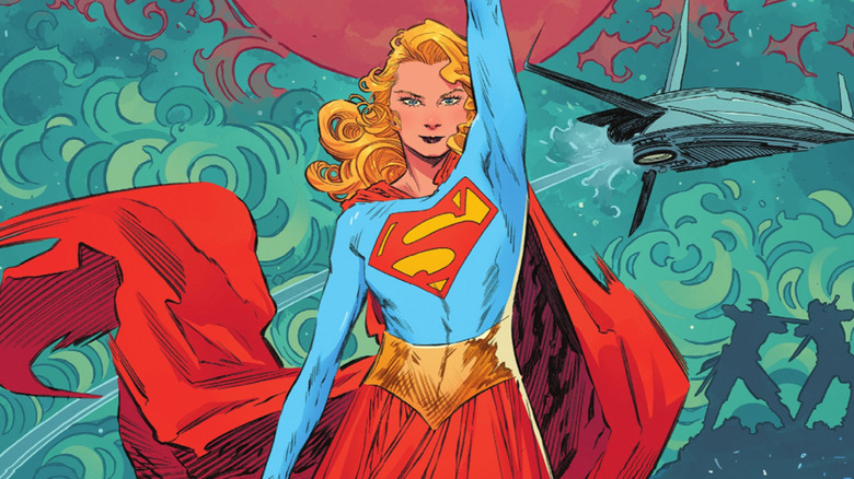Supergirl with her arm raised