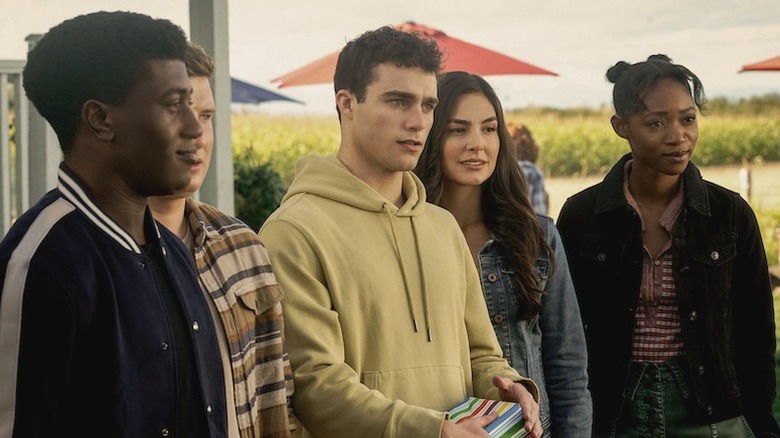 Jonathan standing with group of teens