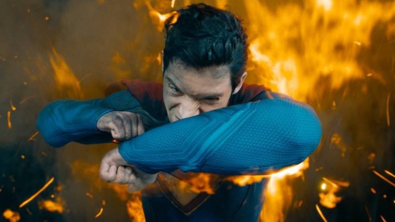 Superman shields himself from flames in "Superman" (2025)