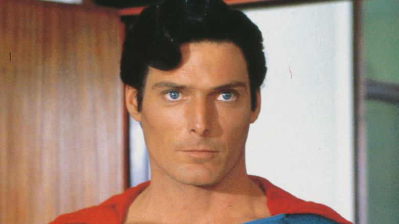 Superman stands in an office doorway in 