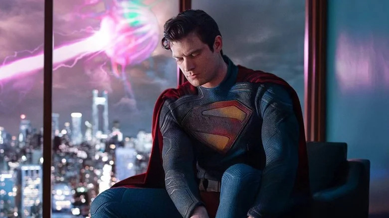 Superman putting boots on