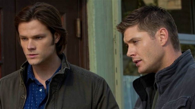 Sam and Dean Winchester taking notes in Supernatural