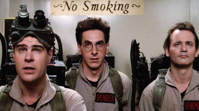 The Ghostbusters wearing their equipment