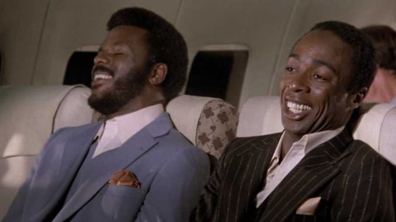 White and Gibbs laughing in Airplane!