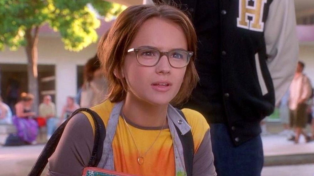 Laney with hair up and glasses on