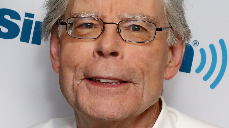 Stephen King smiles