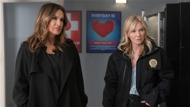 Benson and Rollins standing side by side