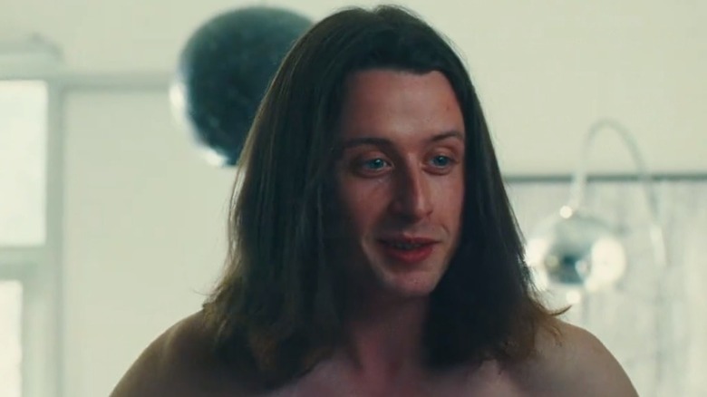 Rory Culkin's nameless character from Swarm smiling and shirtless