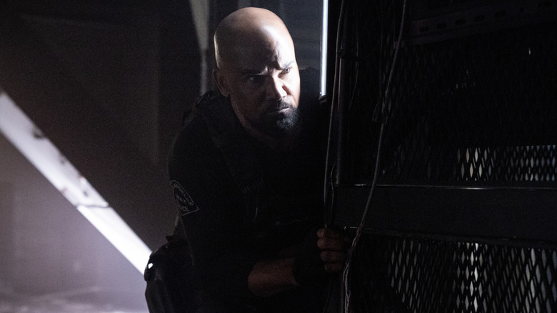 Hondo peeks around a dark corner in "S.W.A.T."