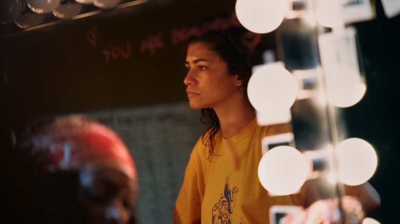 Rue looking into a lit mirror on Euphoria