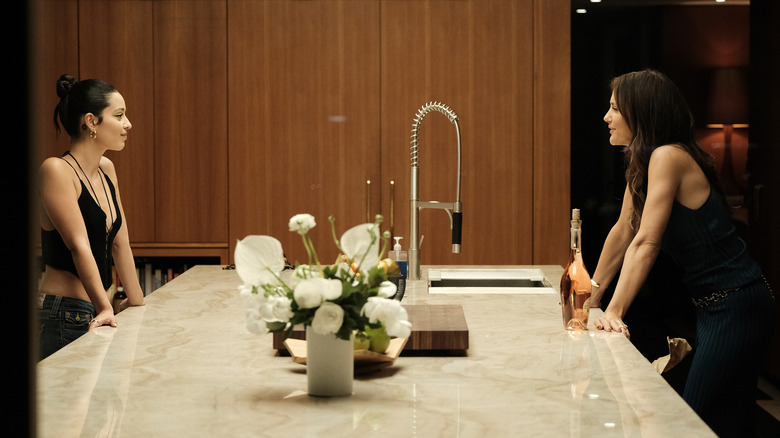 Maddy and Samantha talking across a kitchen island on Euphoria