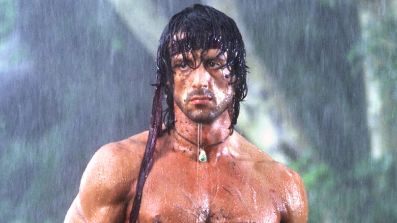 Rambo shirtless in rain