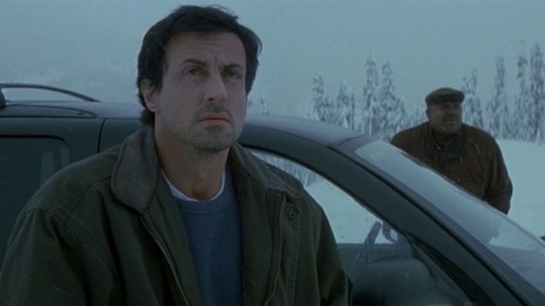 Jake and Hendricks get out of the car in the snow in D-Tox