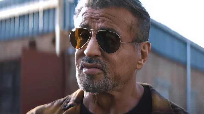 Sylvester Stallone looking sad in sunglasses