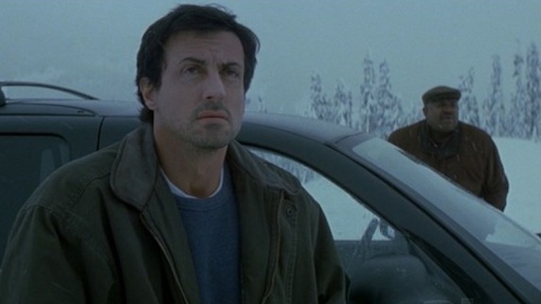 Jake and Hendricks get out of the car in the snow in D-Tox