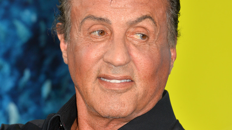 Sylvester Stallone looking to the side