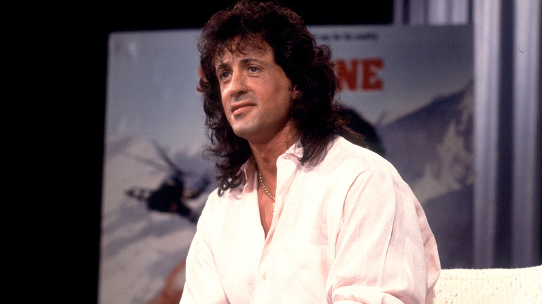 Sylvester Stallone seated for an interview