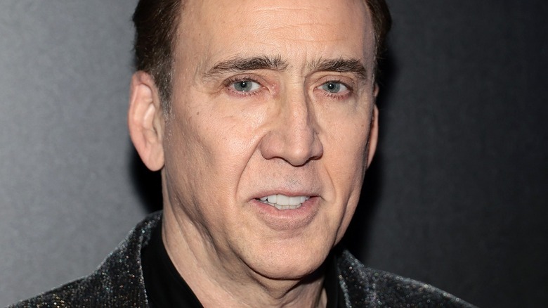 Nicolas Cage caught mid conversation