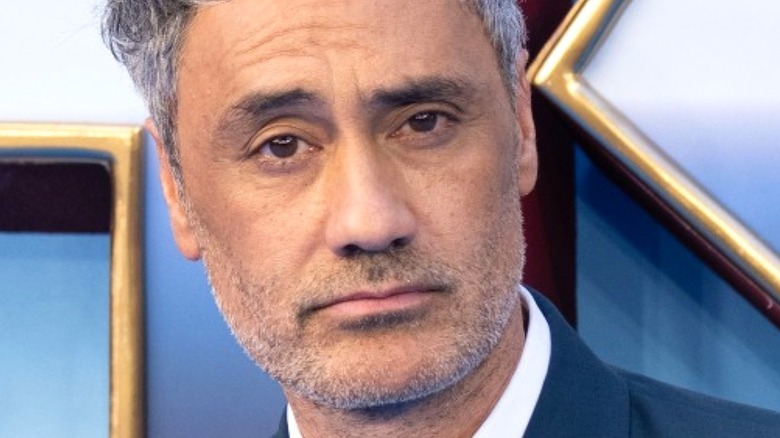Taika Waititi looking into camera