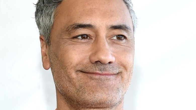 Taika Waititi posing for a photo