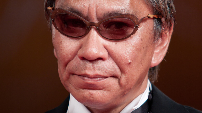 Takashi Miike wearing glasses