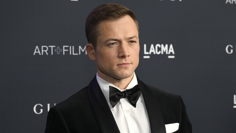 Taron Egerton wearing a tux