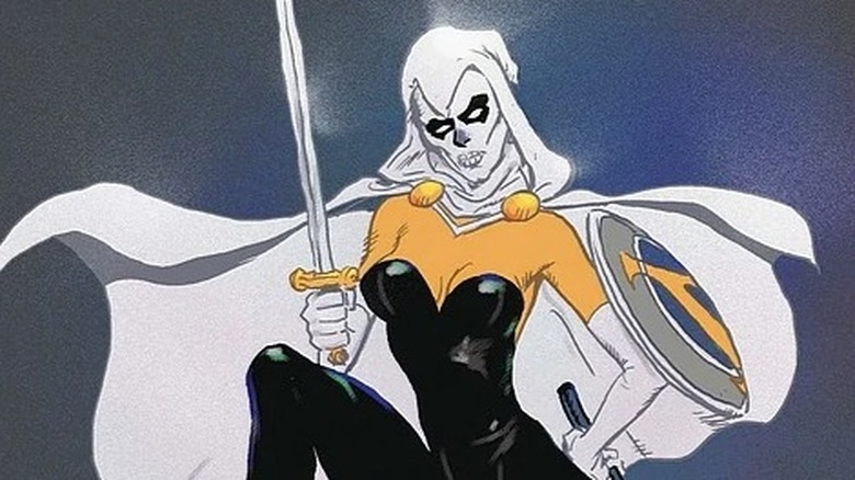 Taskmaster stands with her leg raised, propping up a sword on her knee.