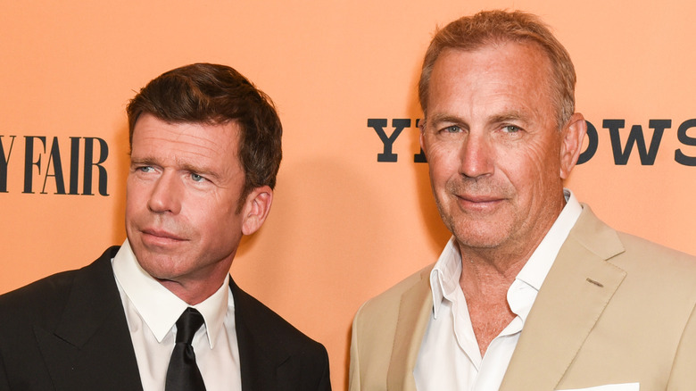 Taylor Sheridan standing by Kevin Costner 