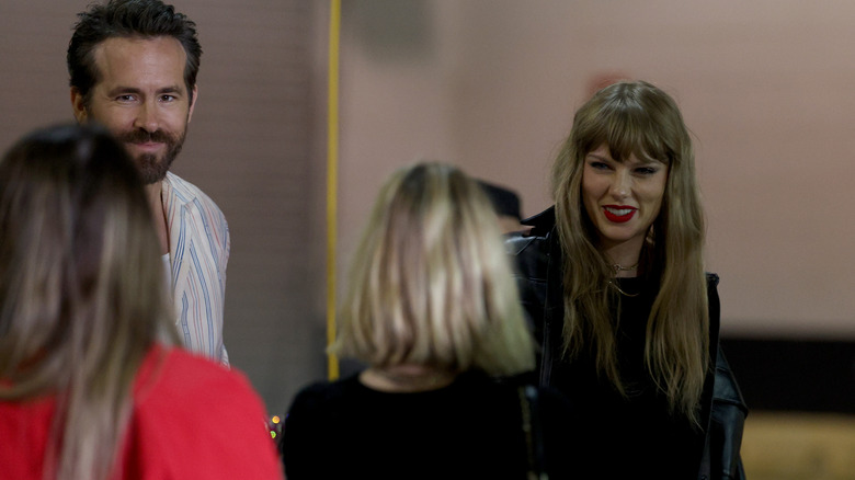 Taylor Swift with Ryan Reynolds at event