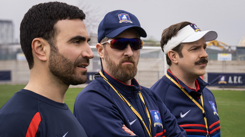 Ted, Roy and Beard look on